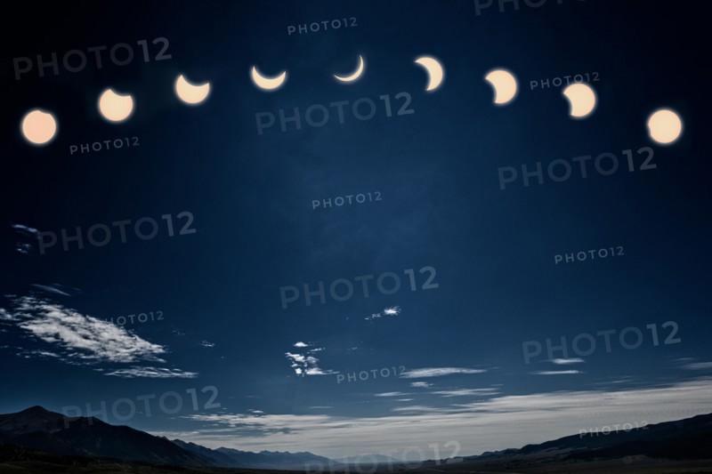 Photograph of the midday solar eclipse; the moon between earth & the sun
