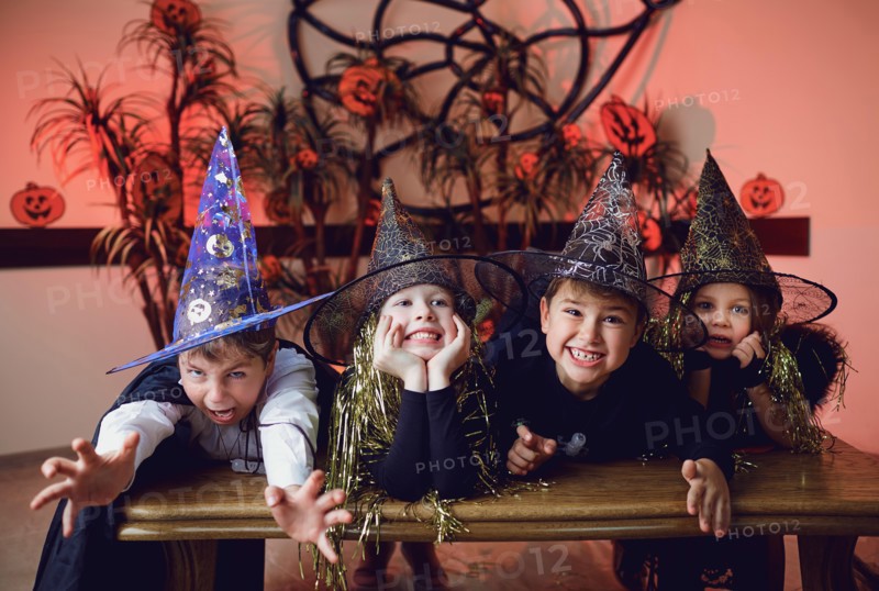 A group of children in costumes on a Halloween holiday