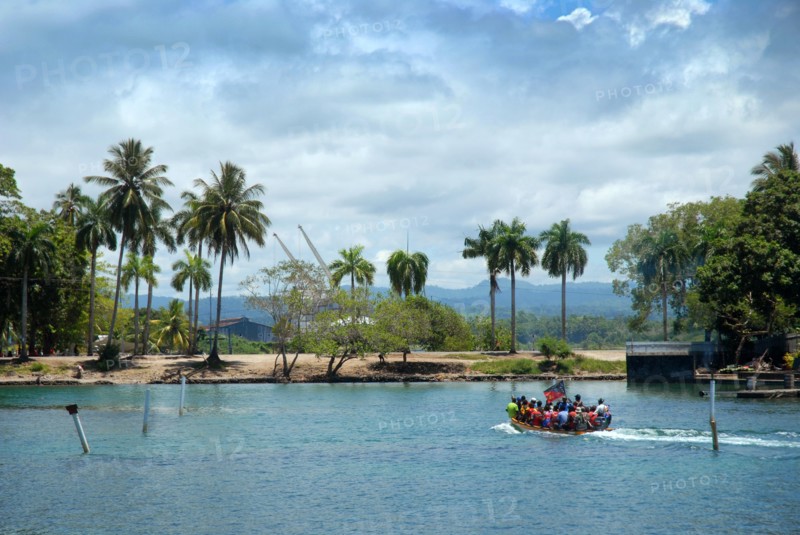 Small boat with passengers, Madang Harbour, Madang, PNG.