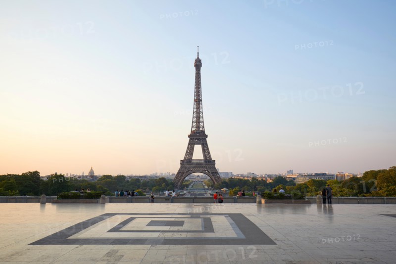 PARIS, FRANCE - JULY 7, 2018: Eiffel tower, some people in a clear summer morning in Paris, France