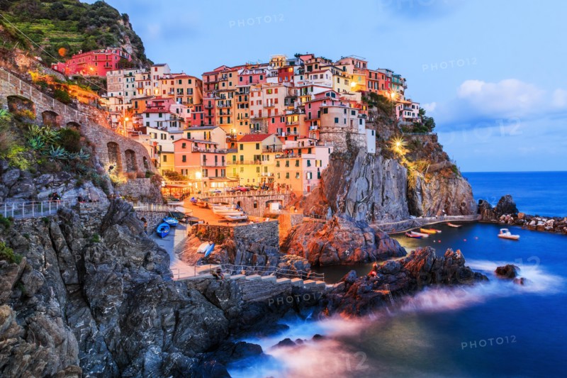 Manarola, Cinque Terre, Italy. Panoramic view of Manarola village at night.
