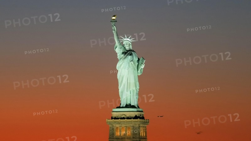 sunset close up of a beautiful statue of liberty in new york