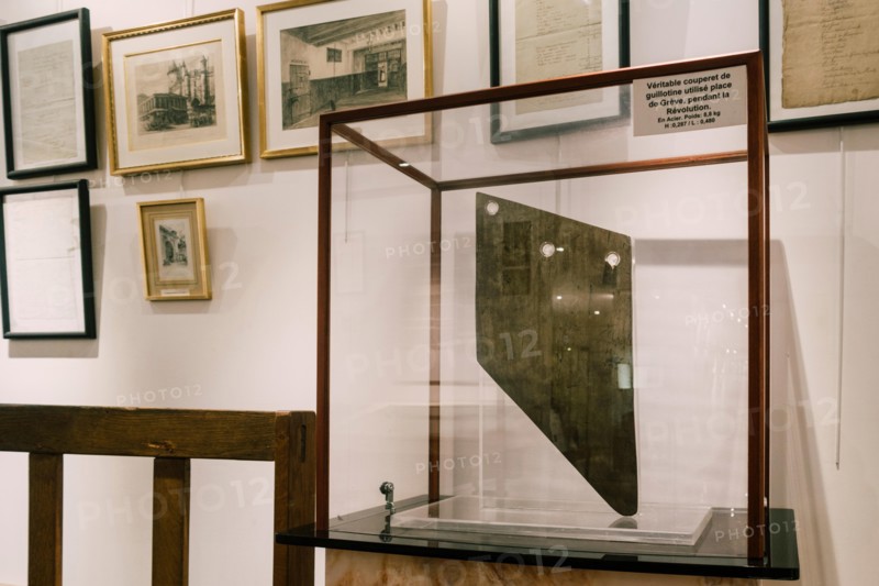 Paris, France - Sept 03, 2019: A guillotine displayed in the Exhibition in the  "Musee de la Prefecture de Paris", (Police Museum) in Paris, France.