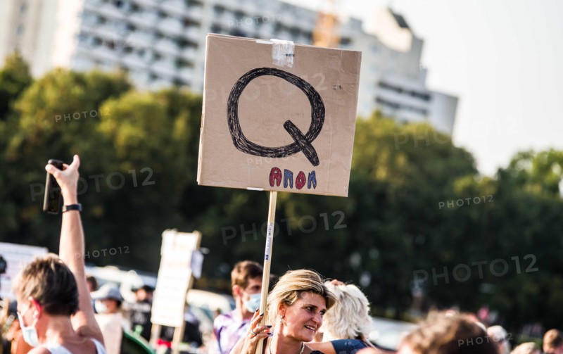 Munich, Bavaria, Germany. 12th Sep, 2020. One of numerous QAnon signs at the Querdenken089 demo. These participants were not asked to leave, nor denounced. The Querdenken ''Conspirituality'' group that held the demos in Berlin against the anti-Corona measures and ultimately against the German government arrived in Munich after numerous legal hurdles, first marching from Odeonsplatz, before they ended the demo just as police were about to due to failure to comply with regulations. 10,000 then assembled at Theresienwiese with minimal distancing and few masks. The group criticized police