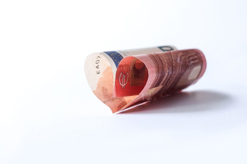 Love and money concept. Financial freedom theme - collect wealth by saving and investing small sums.