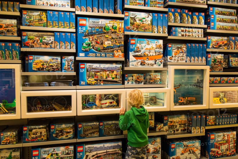 A boy looking at a display in the Lego Store on the shopping street Strøget in Copenhagen, Denmark
