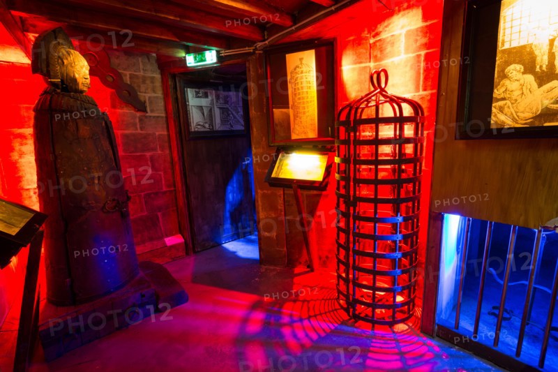 Iron Maiden and a hanging cage in the Torture Museum in Amsterdam, The Netherlands, Europe.