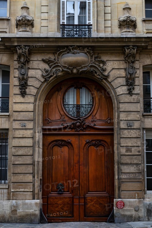 Ornate Paris Door - Thousands of doors and gates adorn buildings in Paris.  Some of the best are on government offices, cathedrals and churches, as we