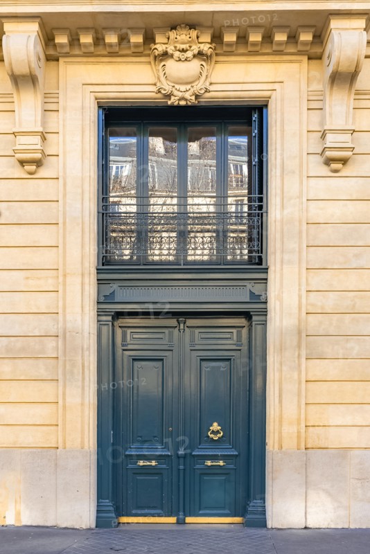Paris, beautiful wooden door, typical window in the Marais