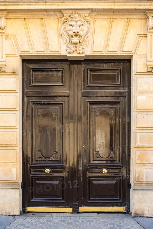 Paris, beautiful wooden door, typical window in the Marais