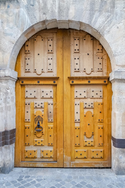 Paris, beautiful wooden door, typical window in the Marais