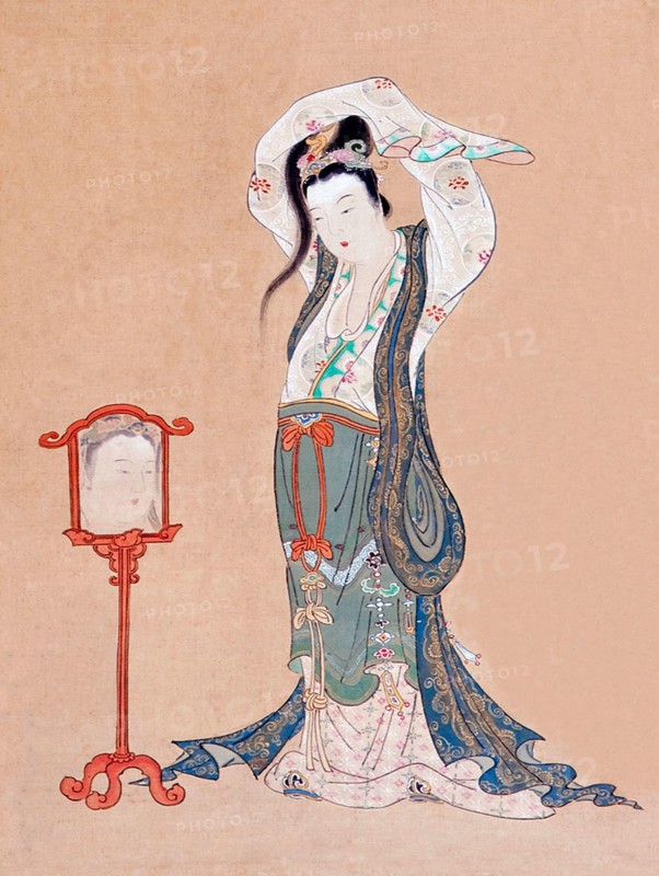 Japan: 'A Chinese Beauty'. Hanging scroll painting by Maruyama Okyo (12 June 1733 - 31 August 1795), 18th century.

Maruyama Okyo, born Maruyama Masataka, was an artist of the Edo Period who specialised in painting in a traditional Chinese style combined with Western elements such as perspective. This features in 'Portrait of a Chinese Beauty' with the use of reflection (albeit inaccurately rendered) in the mirror. He founded the Maruyama school of painting and it proved a success with laypeople, despite the criticism of his fellow artists for his slavish devotion to natural representation.