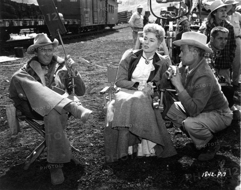 JAMES STEWART ELAINE STEWART and Director JAMES NEILSON with Movie Crew on set location candid in the Colorado Rockies during filming of NIGHT PASSAGE 1957 story Norman A. Fox screenplay Borden Chase music Dimitri Tiomkin cinematographer William H. Daniels costume design Bill Thomas Universal International Pictures