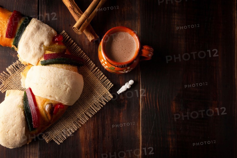 Traditional Kings day cake also called Rosca de Reyes, roscon, Epiphany Cake and with a clay Jarrito. Mexican tradition on January 5th