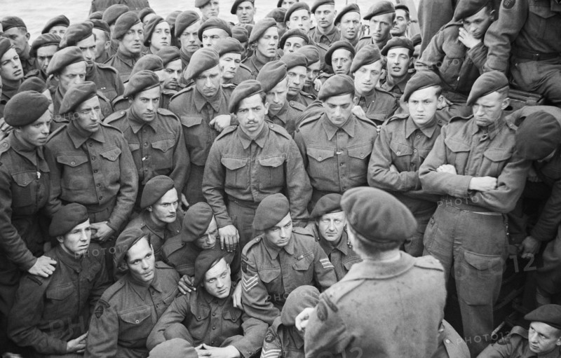 Operation Overlord (the Normandy Landings)- D-day 6 June 1944 Men of 4 Commando being briefed by Lt Col R Dawson in preparation for D Day.