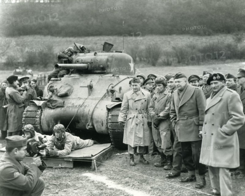 GENERALS EISENHOWER and Montgomery at right watching US troops exercising at Warminster on 28 February 1944