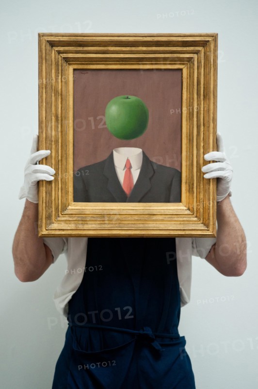 London, UK. 7th June 2013. A Sotheby's employee named Pietro holds “L’idee” by Rene Magritte (Est. 1.8 – 2.5million) during the preview of this summer auction at Sotheby's estimated at £100 million. Credit:  Piero Cruciatti/Alamy Live News