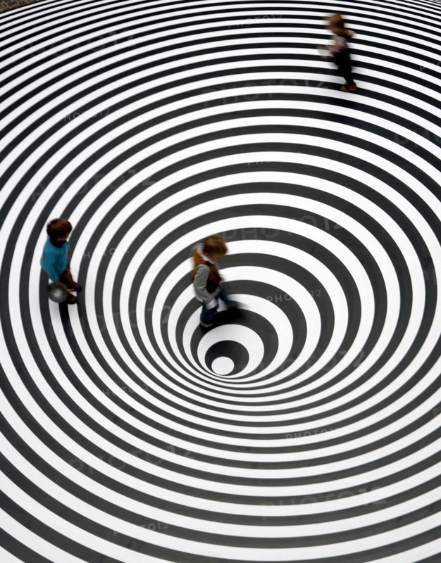 Three children play on the walkable disc 'Spazio ad Attivazione Cinetica' by the Italian artist Marina Appolonio at the entrance of the Schirn exhibition hall in Frankfurt, Germany, 16 February 2007. It features in the exhibition 'Op Art' that runs at the Schirn Frankfurt from 17 February to 20 May 2007. The 'Op Art' formed in the early sixites with a strong interest in scientific