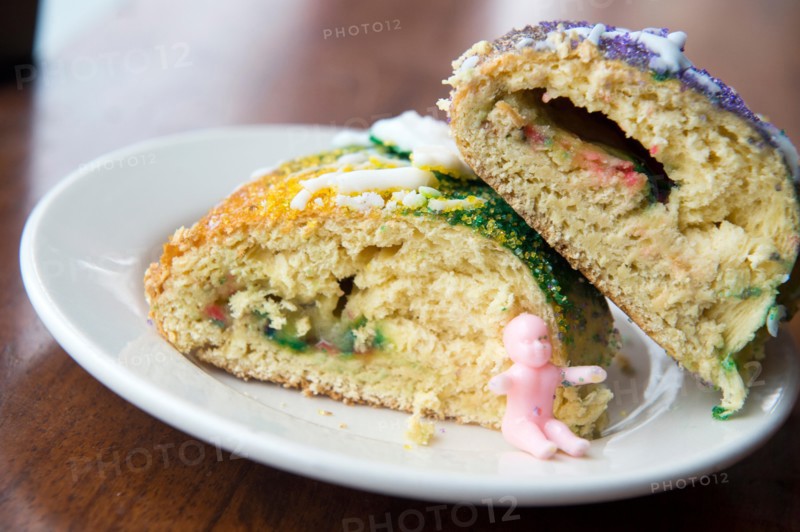 Plated slices of New Orleans king cake.