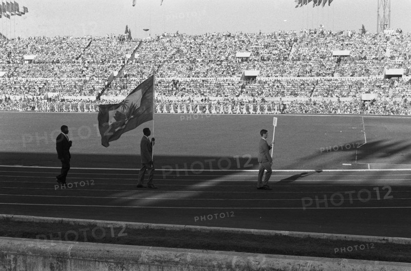 Olympic Games in Rome. Opening. Entry of the athletes in the Olympic Stadium. [The delegation of Haiti consists of one athlete, weightlifter Philomene Lagurre and delegation head Pierre Plaisimond] Annotation: During his race he succeeded only pressing one weight Date: August 25, 1960 Location: Rome Keywords: athletes, openings Institution Name: Olympic Stadium  : Pot, Harry / Anefo Copyright Holder: National Archives Material Type: Negative (black / white) archive inventory number: see access 2.24.01.05