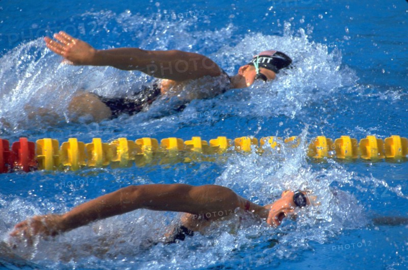 Barcelona, Spain, 1992: Team USA swimmer Nicole Haislett, top, competing in freestyle event at the 1992 Summer Olympics. ©Bob Daemmrich