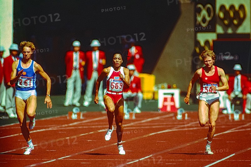 Florence Griffith Joyner (USA) #554  competes in the Women's 100m Semi-Final at the 1988 Olympic Summer Games.