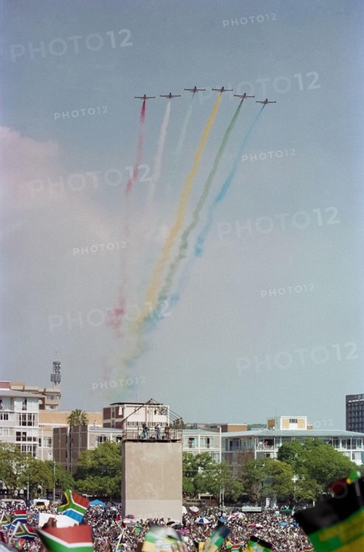 A display with coloured smoke by the Silver Falcons, aerobatic team of the South African Air Force, at Nelson Mandela's inauguration in Pretoria, 1994.