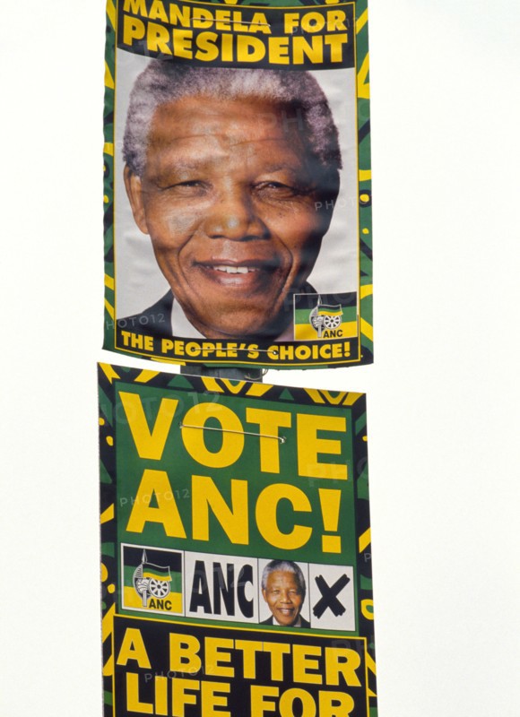 Posters urge voters in South Africa's first multi-racial elections in 1994 to elect black activist Nelson Mandela, who won.