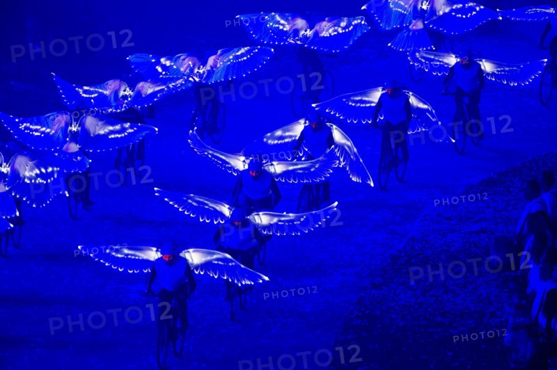 July 27, 2012 - London, England, United Kingdom - Bike a.m, a celebration of the bicycle and the traditional doves which, from ancient times, were released at the Games to signal peace during the Olympics 2012 Opening Ceremony at the Olympic Stadium. (Credit Image: © Paul Kitagaki Jr./ZUMAPRESS.com)