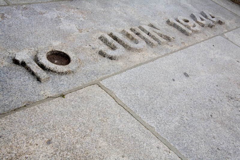 Carved date in stone floor at the French village Oradour-sur-Glane. It reads 10 June 1944