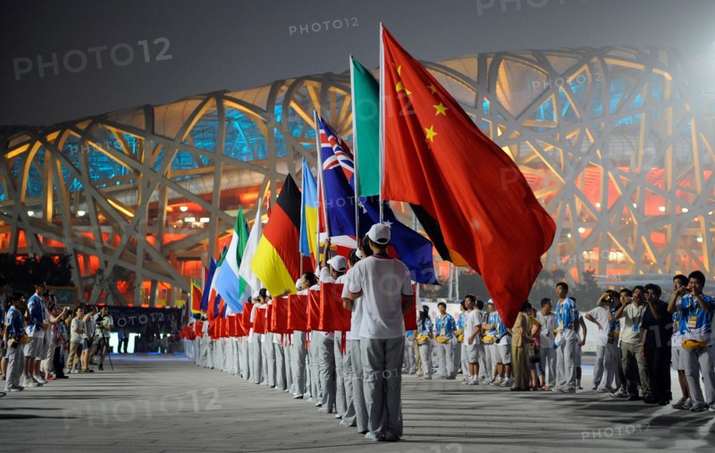 The flags of all participating nations of the 2008 Olympic Games are carried into the National Stadium at the rehearsal of the opening ceremony in Beijing, China, 30 July 2008. The Beijing 2008 Summer Olympic Games will kick off on 08 August 2008. Photo: Gero Breloer