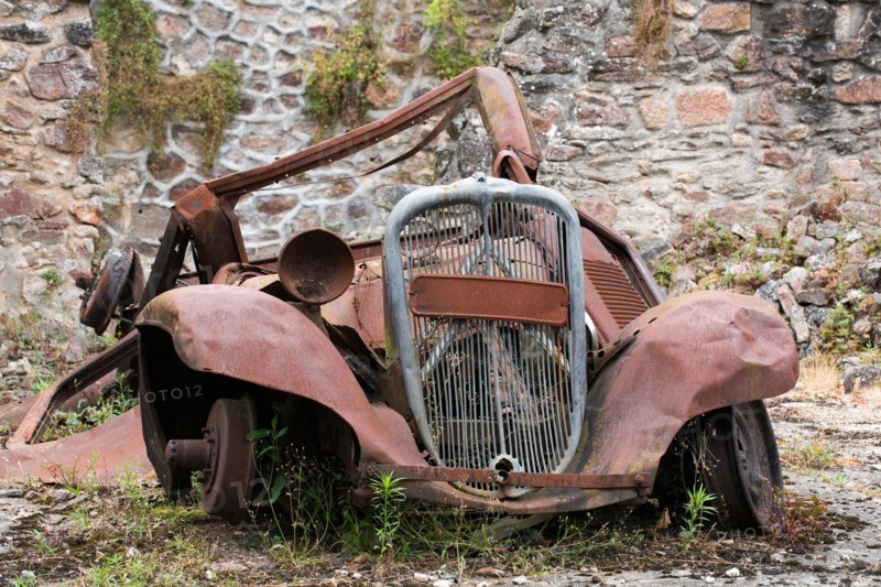 Rusting car at Oradour-sur-Glane. The village was destroyed on 10 June 1944 by German soldiers.