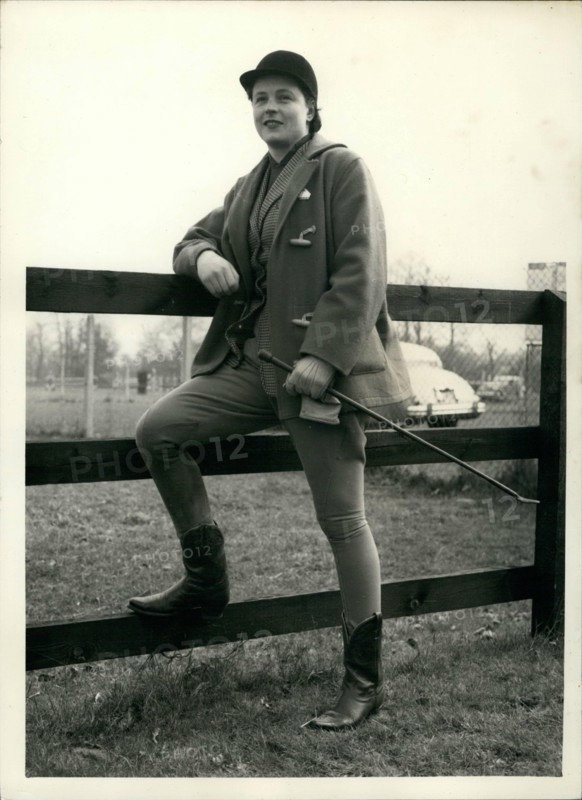 Mar. 03, 1956 - Olympic games Equestrian team in training. Pat Smythe in Texas style boots.: Members of the Olympic games Equestrian Team were to be seen in training this morning at Windsor Forest stud, Ascot. Photo shows Pat Smythe wears Texan style boots prior to going for a training round at Windsor Forest Stud this morning.