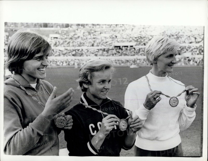 Sep. 01, 1960 - Olympic Games In Rome. Men's 100 Metres Heats Event. Photo shows V. Krepkina, of Russia, pictured in centre with her Gold Medal, after winning the Women's Olympic Long Jump in Rome yesterday. On left is H. Claus (Germany), with her bronze medal and on right is E. Krzesinska, of Poland, with her silver medal.