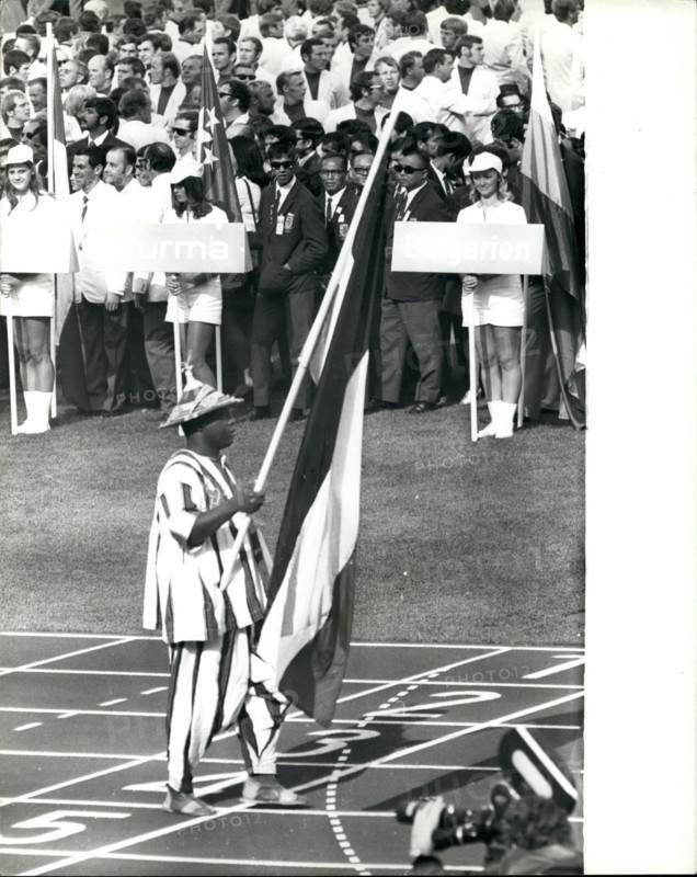 Aug. 08, 1972 - Opening Ceremony of the 20th Olympic Games in Munich Parade of Team in the Olympic Stadium: Photo shows the flag bearer from the African State of Obervolta in his Black and White stripped outfit leads his team during the opening ceremony.