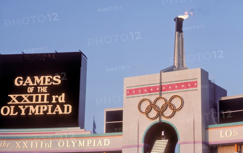 Rafer Johnson brings Olympic torch to light flame during opening ceremonies at 1984 Olympic Games in Los Angeles.