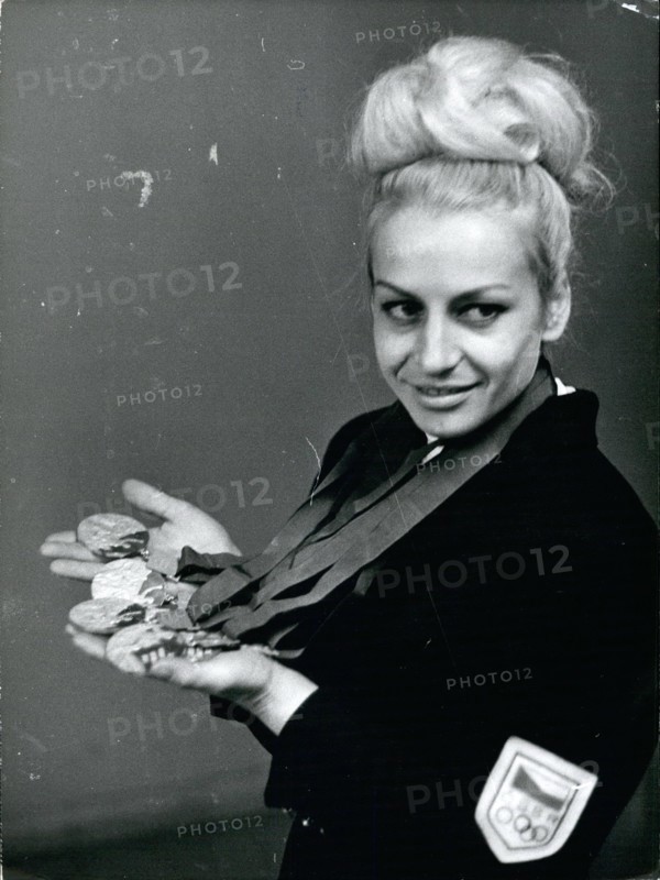 File. 31st Aug, 2016. VERA CASLAVSKA (May 3, 1942, Prague, Czech Republic - August 30, 2016), one of the most decorated gymnasts, has died aged 74 after battling pancreatic cancer. Caslavska won seven Olympic golds and four silvers between 1960 and 1968. The Czech gymnast is one of just five women to win four golds in one Games. A vocal critic of the Soviet Union, Caslavska was forced into hiding in 1968 after signing a document calling for political reforms. Pictured: Oct. 10, 1968 - Olympic Bride In Paris The Olympic Czech couple Vera Caslavska and Jose Odlozil who were married in Mexico