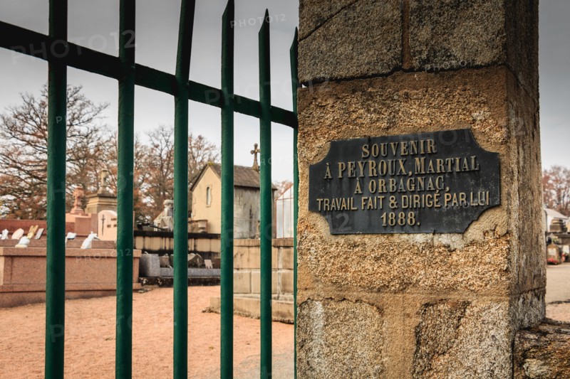ORADOUR SUR GLANE, FRANCE - December 03, 2017 : commemorative plaque at the entrance of the cemetery where it is written in French - souvenir to PEYRO