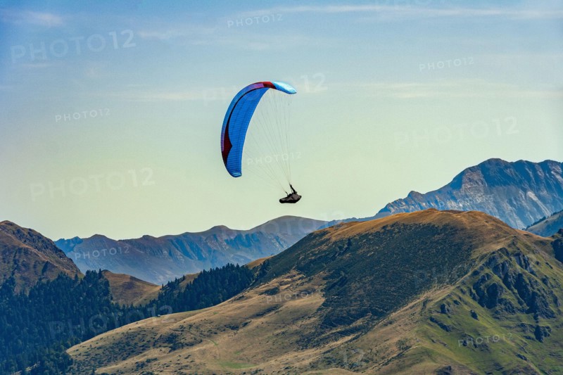 Paragliding, extreme sport, flying over the Pyrenees on the French side. Luchon Superbagnères Ski Resort, France