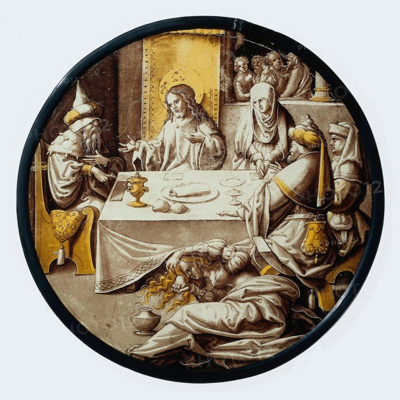 Netherlands: 'The Banquet of Simon of Bethany'. The story of Mary of Bethany, painted on stained glass by an unknown artist, c. 1515-1520.  This painting depicts a Biblical tale about Simon hosting Jesus Christ for dinner. In front of the table, a sinful woman known as Mary is overcome and washes the Messiah's feet with her tears before drying them with her hair and then anointing them with fragrance from the pot that lies beside her.  Simon is incensed that Jesus is allowing the prostitute to touch him, but Christ admonishes him, saying that the woman's sins are forgiven.