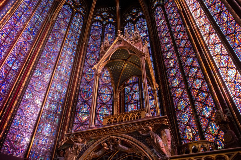 The Sainte-Chapelle church walls filled with colorful stained glass window panels in Paris, France, Europe
