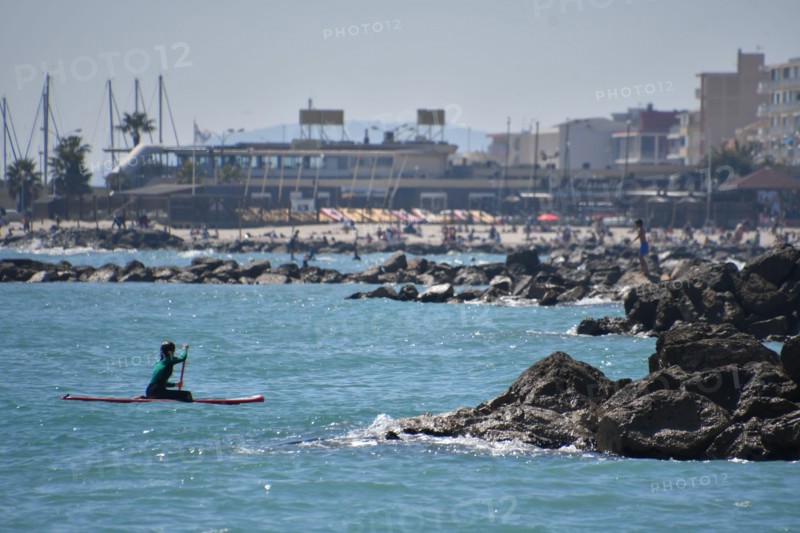 Woman on a paddle in Palavas les Flots, near Carnon Plage and Montpellier, Occitaine, south of France