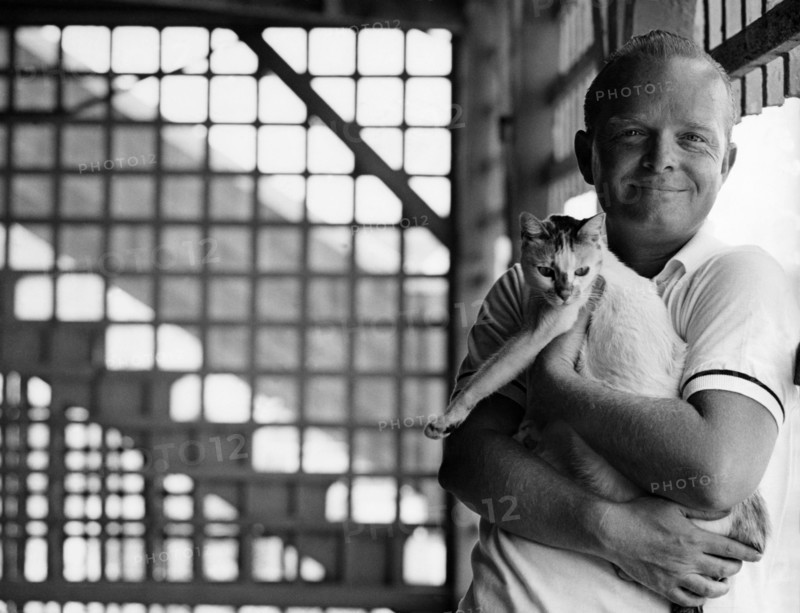 The writer Truman Capote and his cat in 1963. Truman Capote (September 30, 1924 ‚Äì August 25, 1984) was an American writer best known for his true crime book, "In Cold Blood," which is credited with being the first non-fiction novel, and for his short novel "Breakfast at Tiffany's."
