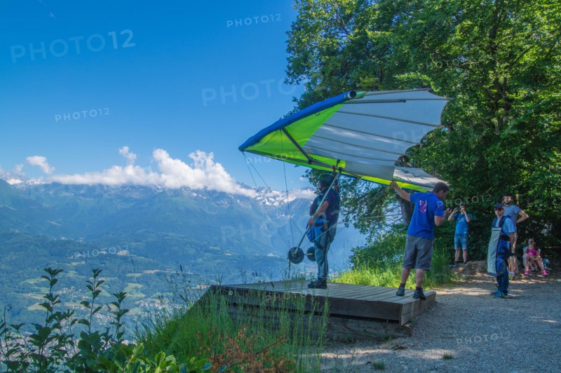 A closup of a person flying on a hang glider