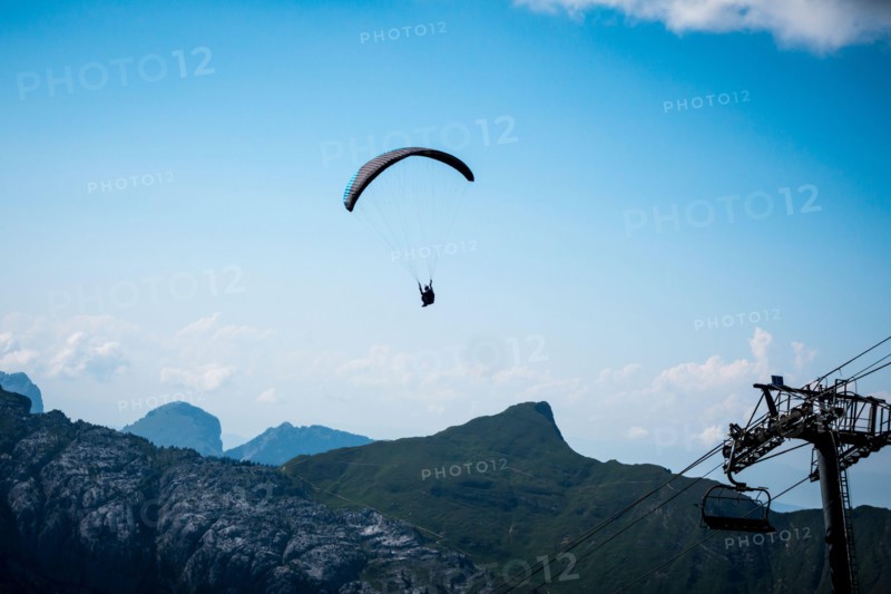 Paragliding flight in the mountains. Le Grand-Bornand, France