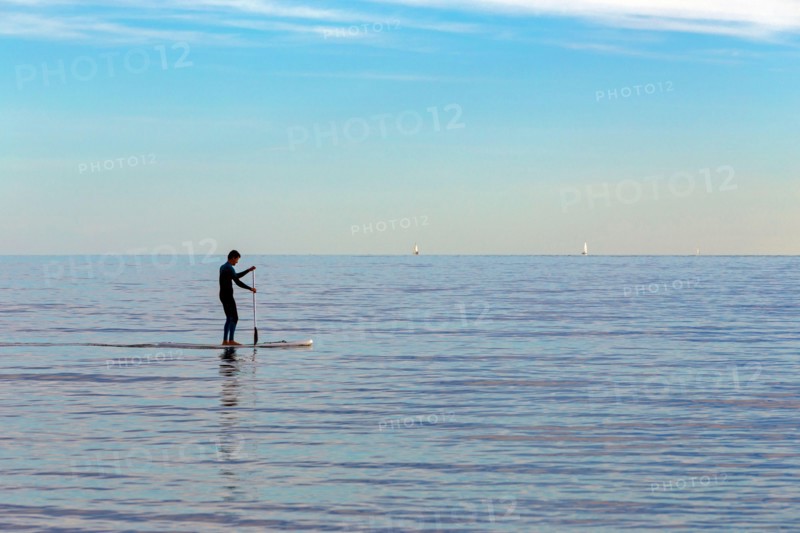 Practice of Stand Up Paddle in the Mediterranean. Carnon, Occitanie, France