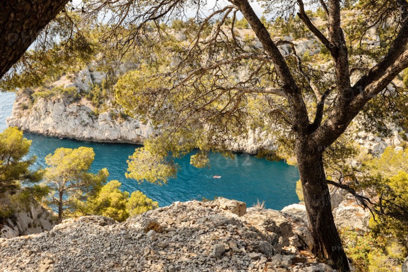 View,views,viewpoint,photo opportunity,from,hiking,path,as,boats,kayaks,enter,Calanque D-En Vau,Only,accessible,by,boat,kayak,or,on foot, Marseille,Calanques of Marseille,Calanques National Park,Marseilles,Commune in, Bouches-du-Rhône, the second largest city of France,Marseille, is the prefecture of the French, department of, Bouches-du-Rhône, and, capital, of the, Provence-Alpes-Côte d'Azur region. South of France,France,French,second largest city in France,August,summer,Europe,European,The cliffs of the Calanques are a natural wonder nestled between Marseille and Cassis.creek,bay,tour boats