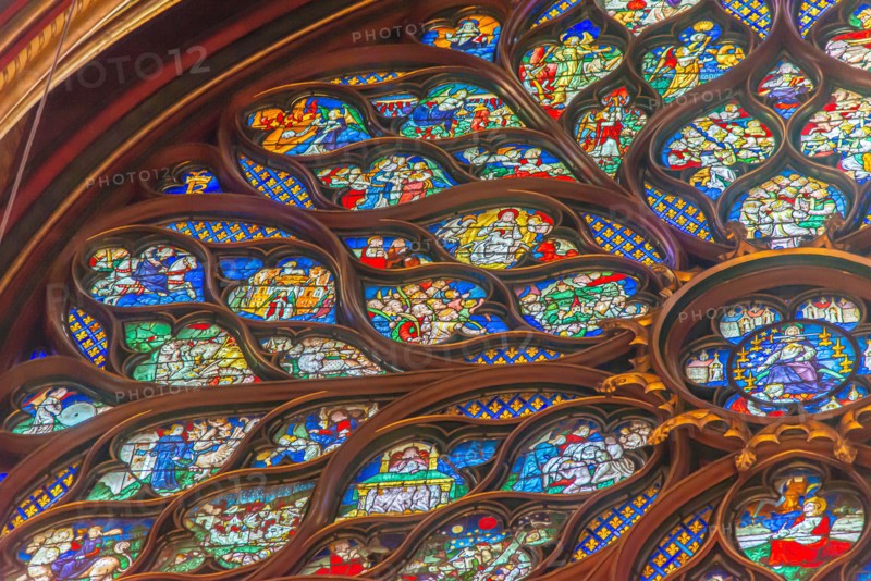 Paris, France - Dec. 27 2022: The stunning stained glass window and the beautiful ceiling in Saint-Chapelle in Paris