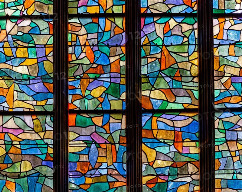 ABBEVILLE, SOMME, FRANCE, JUNE 20, 2023 :  details of stained glasses windows in Saint Sepulcre church, by Alfred Manessier workshop, year 1989  to 19