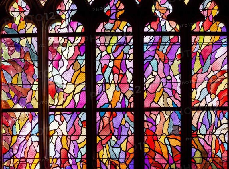 ABBEVILLE, SOMME, FRANCE, JUNE 20, 2023 :  details of stained glasses windows in Saint Sepulcre church, by Alfred Manessier workshop, year 1989  to 19